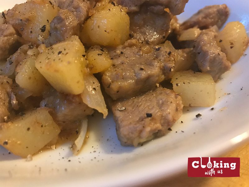 Fried pork with potatoes and onions